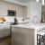 a kitchen with white cabinets